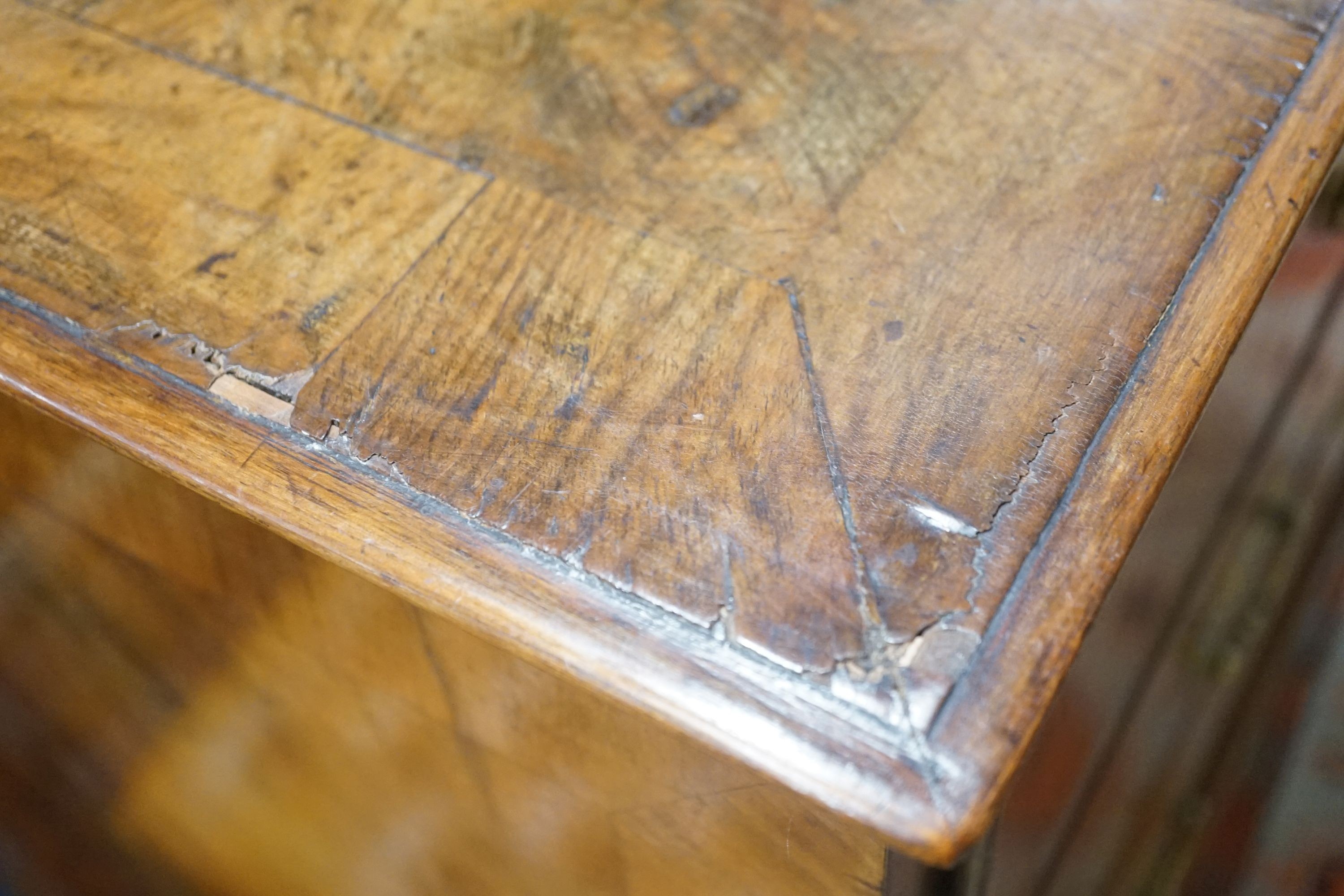 An 18th century walnut chest on later stand, width 104cm depth 52cm height 110cm